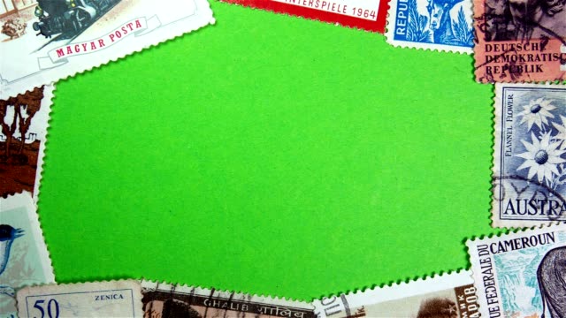 Postage stamps on a green screen