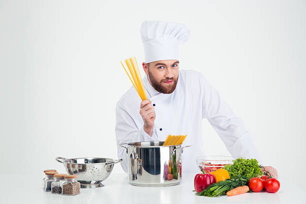 istock Male chef cook preparing pasta 491598354