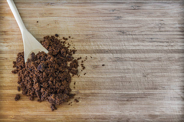 istock Dark muscovado sugar in a wooden spoon 491598438