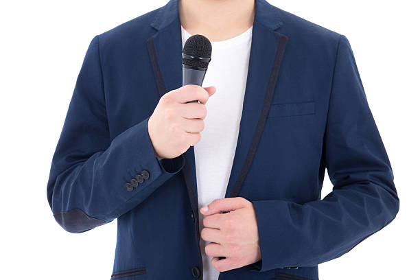istock man in suit with microphone isolated on white background 491599442