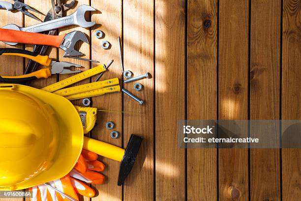 Carpenter Tools On Wooden Background Stock Photo - Download Image Now - Construction Equipment, Work Tool, Table