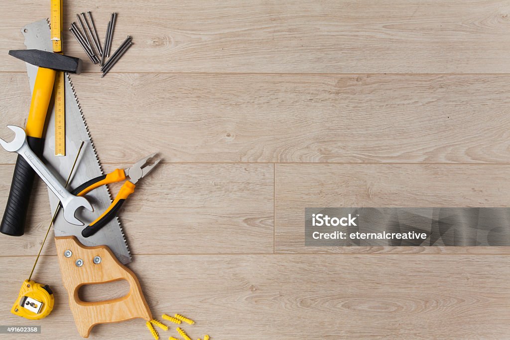 Construction Equipment on Wood Construction tools on a wood background. Work Tool Stock Photo