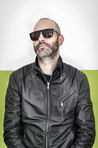 Handsome Italian man with sunglasses and leather jacket