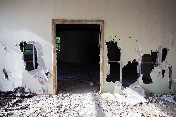 istock Abandoned building interior. Empty door, holes 491604348