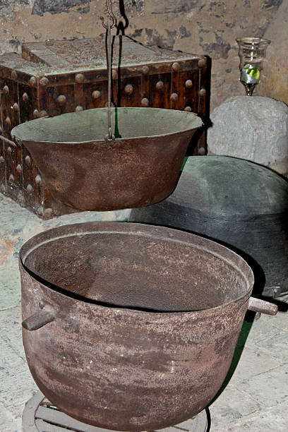 Old copper dishes on wooden shelves. Vintage.