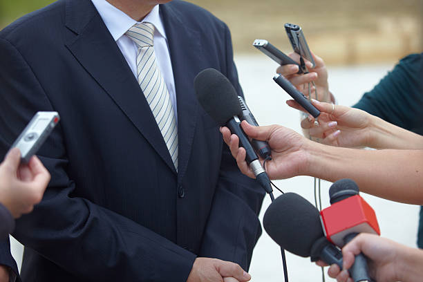 istock business meeting conference journalism microphones 491607553