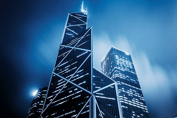 corporate buildings of hong kong corporate buildings in financial district of hong kong day.blue toned images. the bank of china tower stock pictures, royalty-free photos & images