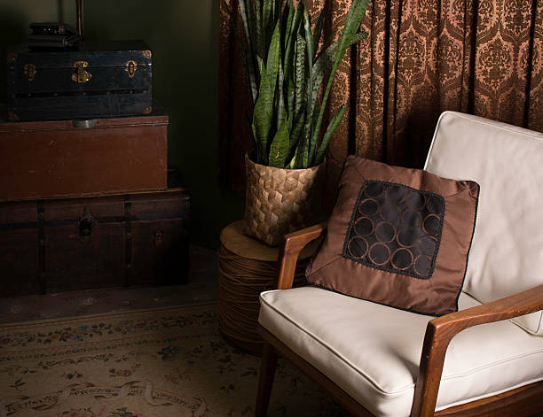 istock Old-fashioned retro style white leather and wood armed chair 491608551
