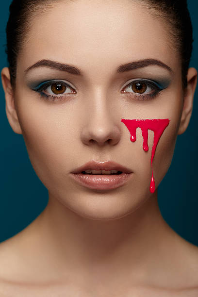 istock Woman with flowing pink paint 491609471