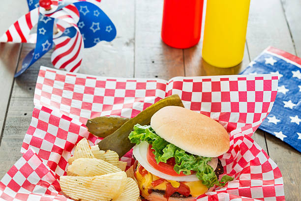 istock Loaded cheeseburger at a patriotic themed BBQ 491611141
