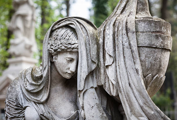 istock statue on grave in the old cemetery 491611795