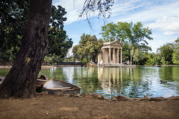 Neoclassical temple and pond in the Villa Borghese Park, Rome Italy