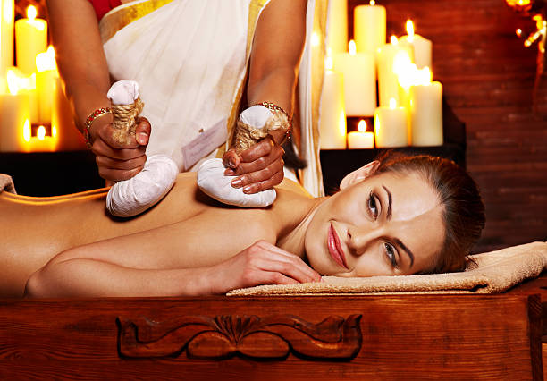 istock Woman having massage with pouch of rice. 491613309