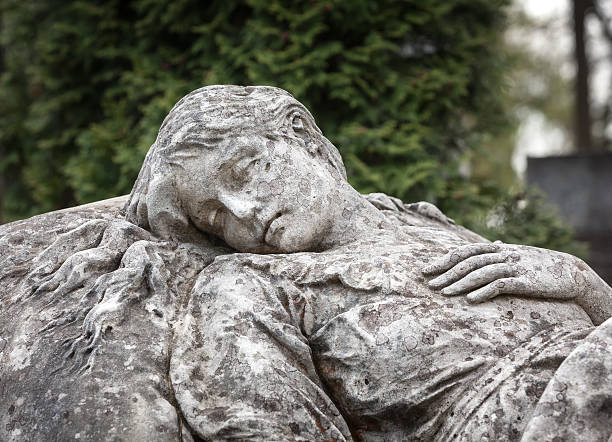 istock statue on grave in the old cemetery 491613609
