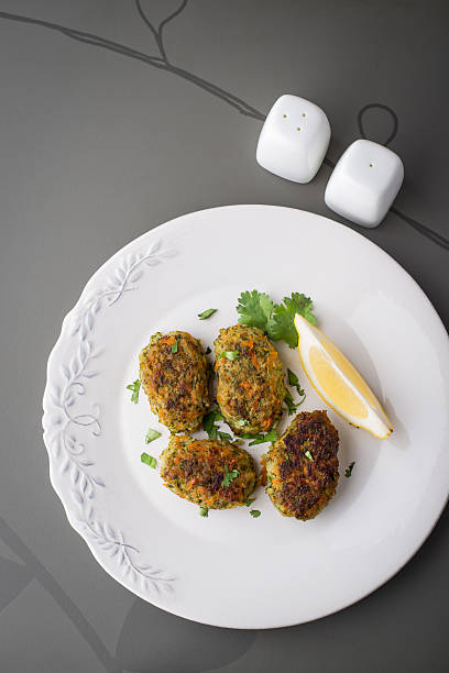 istock Rissoles with vegetables and greens on  grey table top view 491615010
