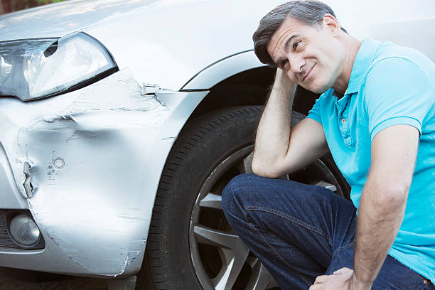 istock Unhappy Driver Inspecting Damage After Car Accident 491615098