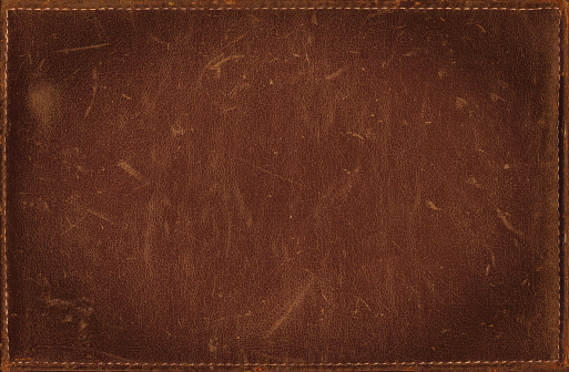 Brown grunge background from distress leather texture with stitched frame