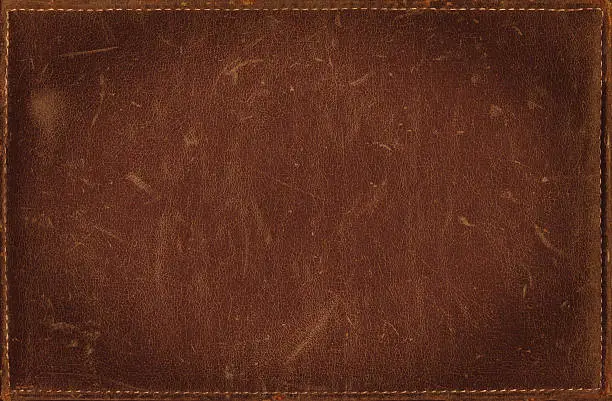 Photo of Brown grunge background from distress leather texture with stitched frame