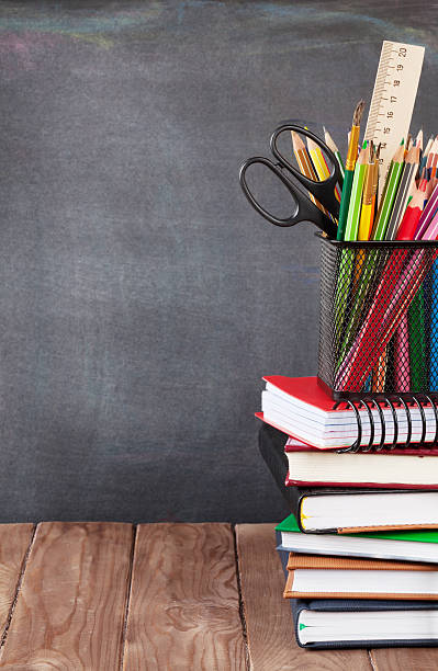 istock School and office supplies on classroom table 491615674