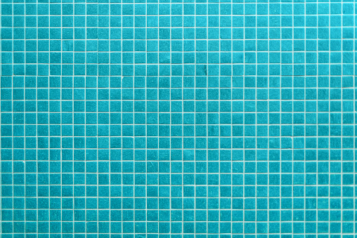 Blue light ceramic wall and floor tiles mosaic background in bathroom and kitchen. Design pattern geometric with grid wallpaper texture decoration pool. Simple seamless abstract surface clean.