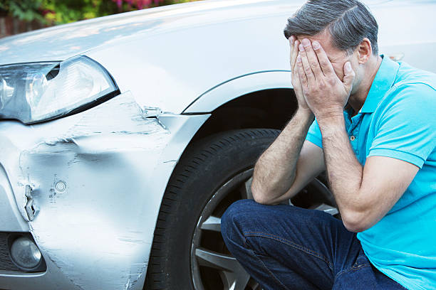 istock Unhappy Driver Inspecting Damage After Car Accident 491616026