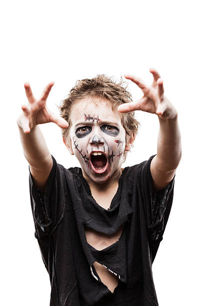 Screaming walking dead zombie child boy Halloween horror costume and makeup concept - screaming walking dead zombie child boy reaching hand face paint halloween adult men stock pictures, royalty-free photos & images