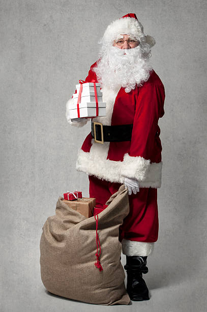 istock Santa Claus with a bag of presents 491616946