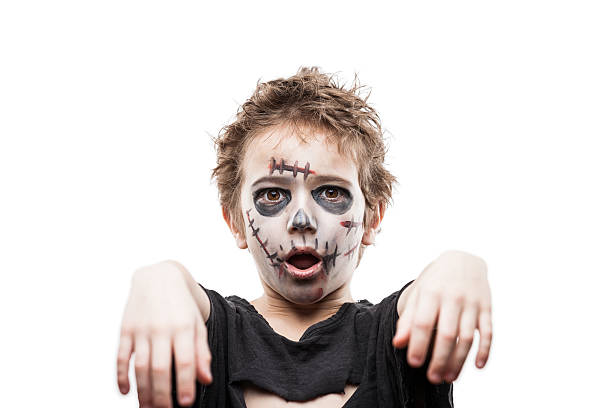 Screaming walking dead zombie child boy Halloween horror costume and makeup concept - screaming walking dead zombie child boy reaching hand halloween face paint stock pictures, royalty-free photos & images