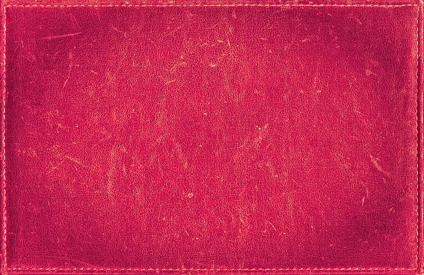 istock Pink grunge background from distress leather texture with stitched frame 491617656