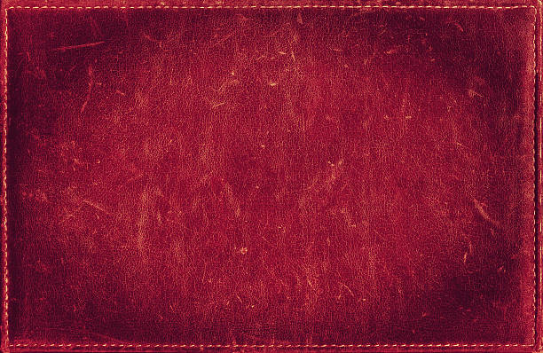Red grunge background from distress leather texture with stitched frame