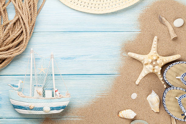 istock Travel and vacation items on wooden table 491621976