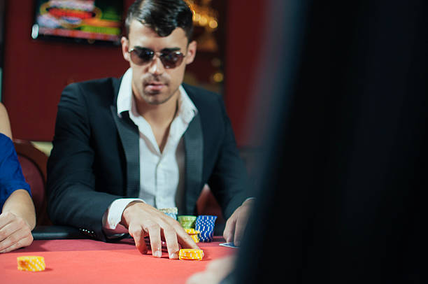 istock Playing poker in casino 491628518