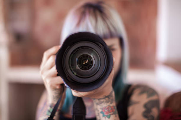 istock Young woman photographer 491630012