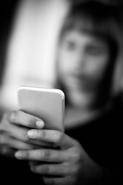 istock Young woman using smartphone at home 491630756