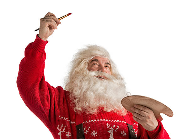 Santa Claus figure holds a star as a symbol of Christmas on the white background. copy space for inscription Idea of new year postcards