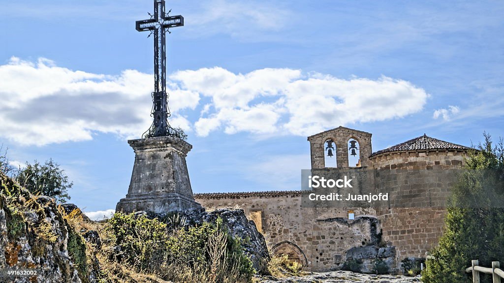 hermitage of San Frutos with iron cross. 
Ermita de San Frutos with its iron cross looking at the blue sky, Sepulveda, Segovia, Spain.

 2015 Stock Photo