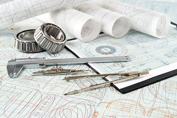 istock roller bearing, vernier callipers , compasses, clipboard and drawings 491632854