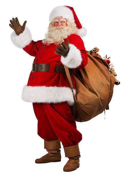 Real Santa Claus carrying big bag full of gifts stock photo