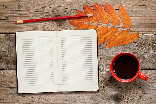 istock Coffee cup, open diary, pencil and autumn leaves 491633618