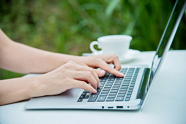 istock Woman typing outside 491641216