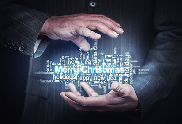 istock Businessman holding christmas word cloud 491641520