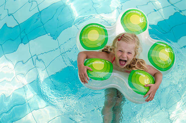 istock laughing girl in the water 491642266