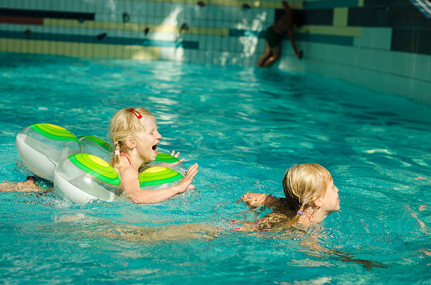 raparigas natação - swimming tube inflatable circle imagens e fotografias de stock