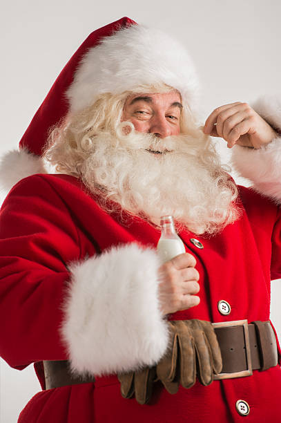 istock Santa Claus drinking milk from bottle 491642722