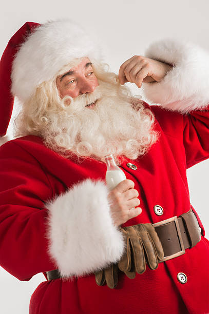 istock Santa Claus drinking milk from bottle 491642756