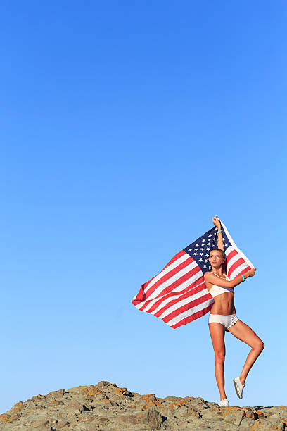 istock Athletic Woman with american flag 491644832