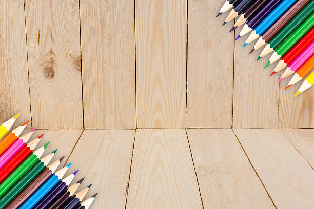 istock Frame of Colour pencils on wood texture background 491645306