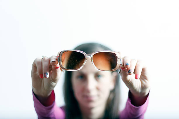 istock Girl holding sunglasses 491647726