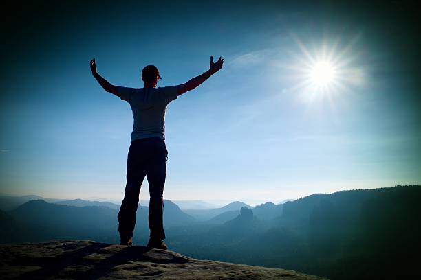 istock Man gesture in cap of triumph with hands in air. 491652828