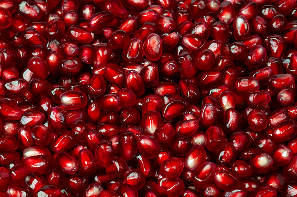 istock Delicious red ripe juicy pomegranate seed background texture 491653196